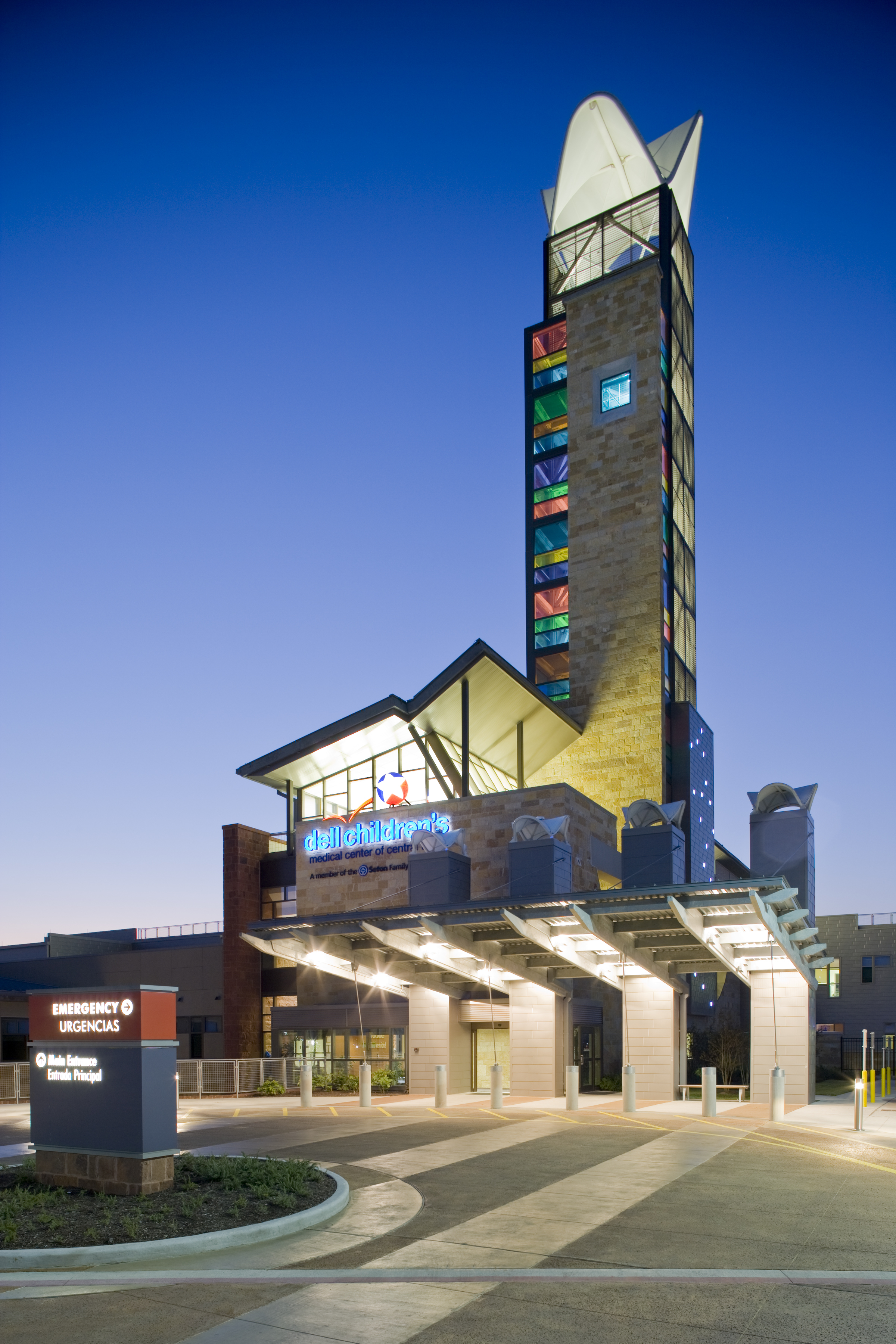Outdoor photo at dusk of the Dell Childrens Medical Center. Lights shining from within. Austin, Tx electrical engineering project.