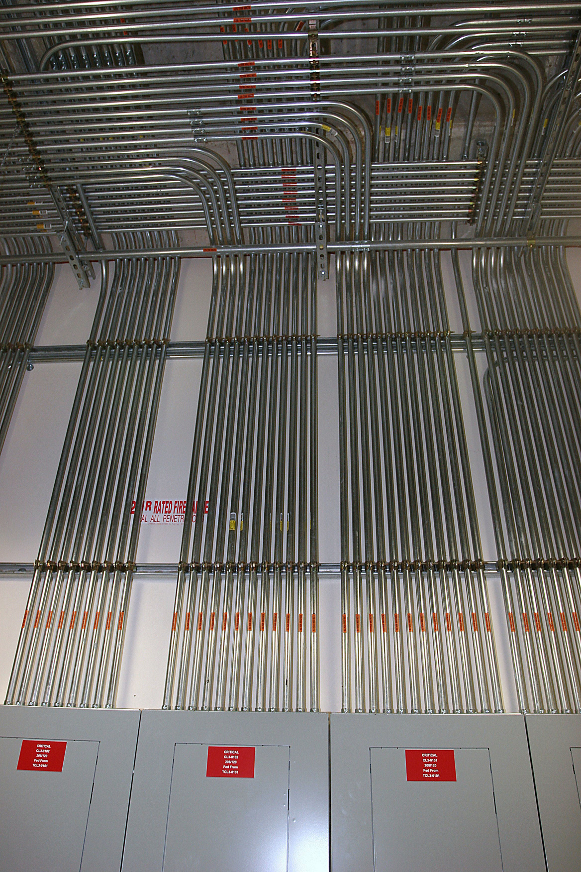 Electrical tubing and wiring streaming out of electrial fuse box at Dell Childrens Medical Center.