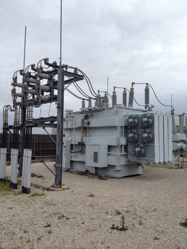 Electric power grid on roof of building.