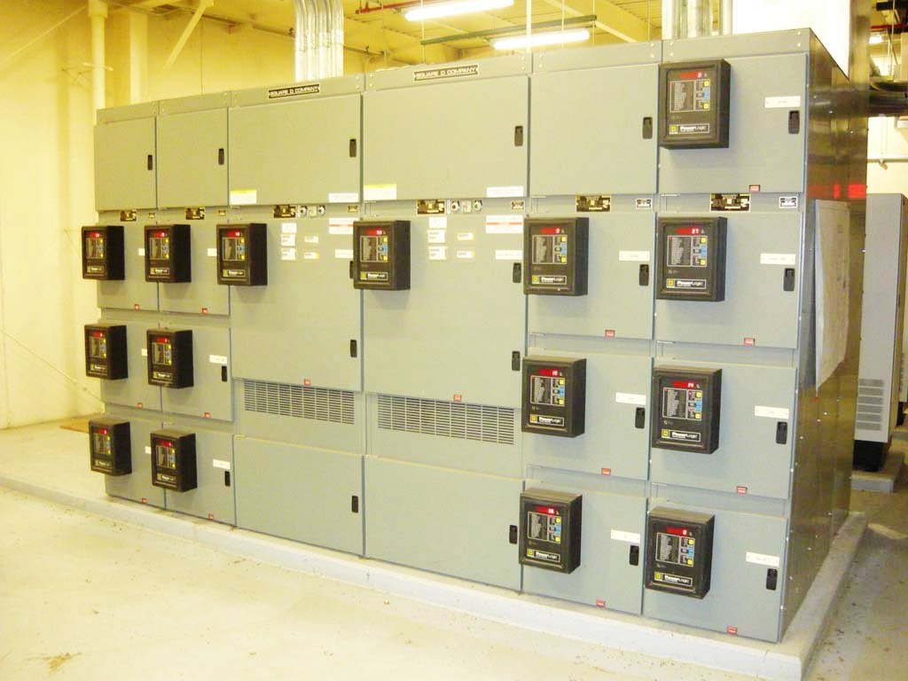 Large Hitachi electrical boxes with meters on the outside.