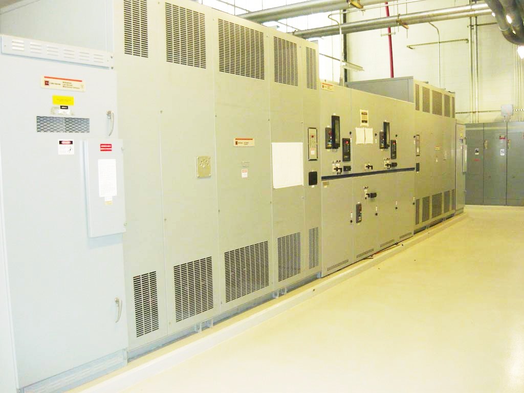 Large Hitachi electrical boxes in a large room.